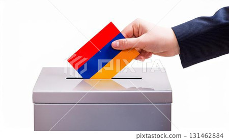 Hand voting ballot and ballot box with Armenia flag. Election. 131462884