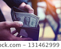 Hand Holding Cash in a Wallet, The Last Dollar 131462999