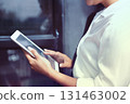 Business Woman Analyzing Financial Data on Tablet. Investment Analysis and Planning 131463002