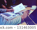 Business Team Analyzing Data on Laptop. Collaboration and Strategy Planning. 131463005