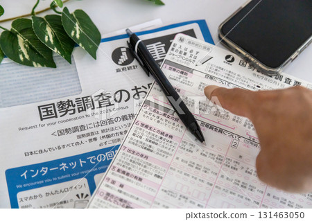 Census stock photo: A man pointing at a census form 131463050