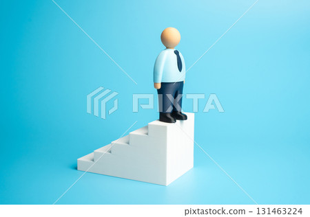 A business worker at the pinnacle of his career. Start a new career or open his own business. Retire. Concept of leadership, achievement, and life transitions. 131463224