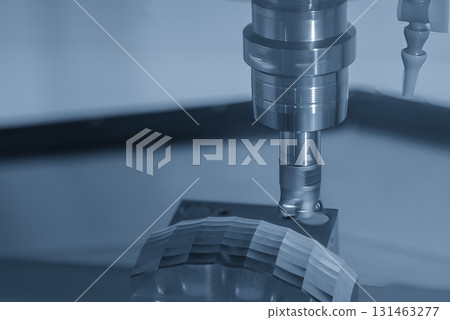 Close up the CNC milling machine rough cut the mold parts in the light blue scene. Close up the CNC milling machine rough cut the mold parts in the light blue scene. 131463277