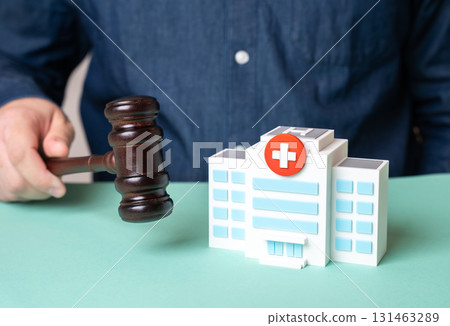 A lawsuit and a hospital. A medical dispute resolution court. Health insurance. Medical malpractice. Useful for law, healthcare policy, patient rights, insurance disputes and legal protection. 131463289