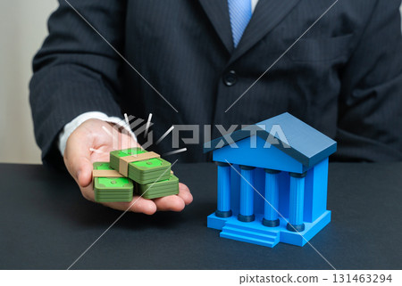 A businessman deposits money in a bank. The money supply is in the hands of the population. Useful for finance, investments, banking sector, savings, economic growth and monetary policy. 131463294