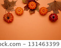 Halloween decoration pumpkins maple leaves autumn festive mood 131463399