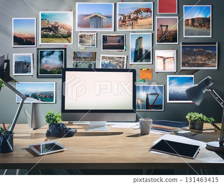 A desk decorated with photographs 131463415