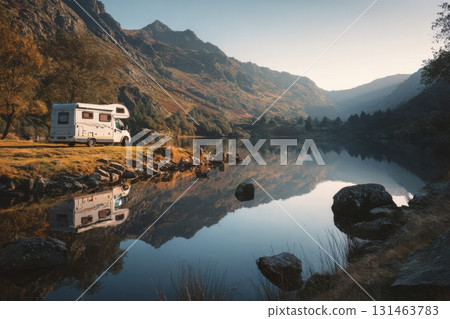 Scenic campground by mountain lake with camper van calm reflection peaceful nature retreat 131463783