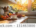 Warm kitchen with morning light and seasonal fruit 131463800