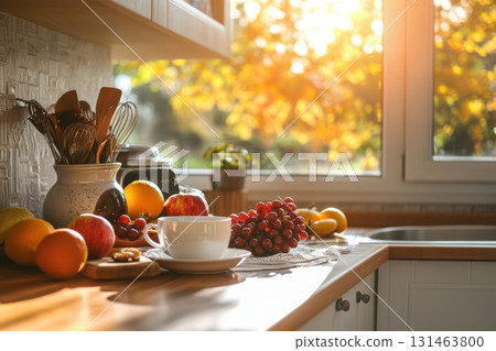 Warm kitchen with morning light and seasonal fruit 131463800