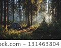 Simple tent setup in forest clearing at dawn 131463804