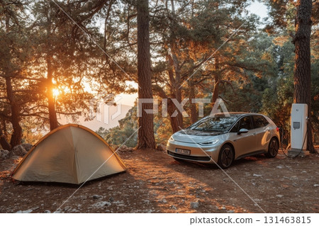 Electric car charging near tent under pine trees, eco-travel Electric car charging near tent under pine trees, eco-travel 131463815