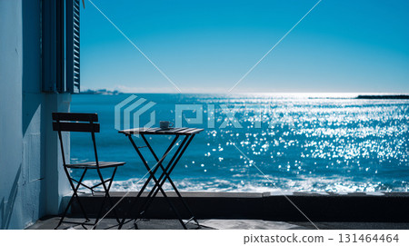 A photo of the terrace seating overlooking the blue sky and sea 131464464