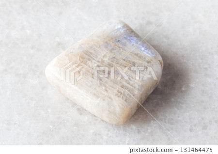 tumbled belomorite moonstone mineral on white 131464475