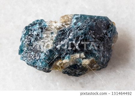 sample of unworked grandidierite mineral on white sample of unworked grandidierite mineral on white 131464492