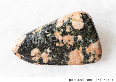 sample of polished gabbro mineral on white marble sample of polished gabbro mineral on white marble 131464523