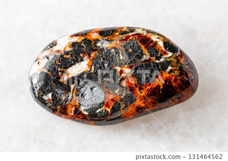 polished franklinite and zincite minerals on white 131464562