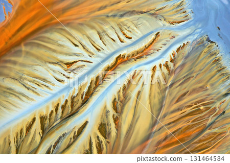 Ecological catastrophe nature pollution concept. Aerial view of abstract natural patterns. Acid mine drainage water background Ecological catastrophe nature pollution concept. Aerial view of abstract natural patterns. Acid mine drainage water background 131464584