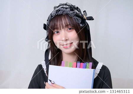 A landmine girl holding a notebook A landmine girl holding a notebook 131465311