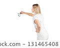 Studio portrait of woman with magnifying glass 131465408
