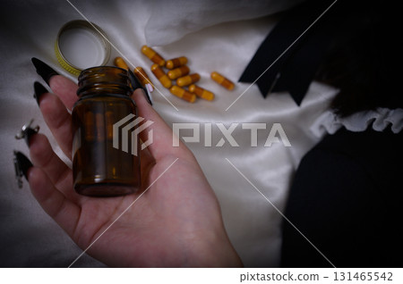 A landmine girl lying on the bed with medicine A landmine girl lying on the bed with medicine 131465542