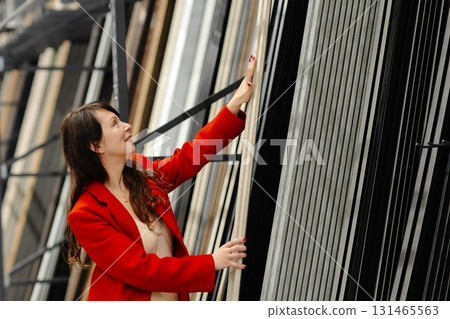 Architect choosing construction materials for new project in warehouse Architect choosing construction materials for new project in warehouse 131465563