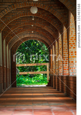 Retro style architectural scenery, antique red brick corridor 131465588