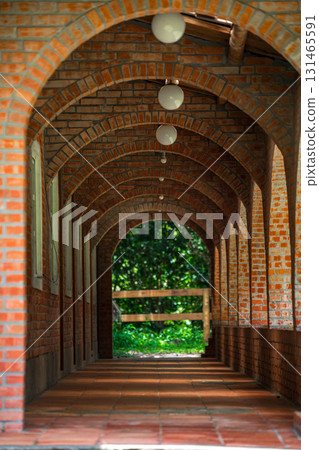 Retro style architectural scenery, antique red brick corridor 131465591