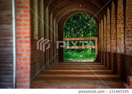 Retro style architectural scenery, antique red brick corridor Retro style architectural scenery, antique red brick corridor 131465595