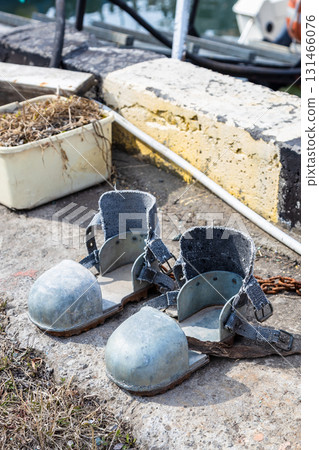 heavy diving boots in urban port outdoors 131466076