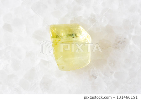 unworked heliodor yellow beryl crystal on white unworked heliodor yellow beryl crystal on white 131466151