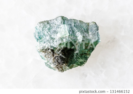 sample of rough green alexandrite crystal on white sample of rough green alexandrite crystal on white 131466152