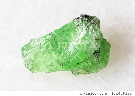 sample of rough tsavorite garnet mineral on white sample of rough tsavorite garnet mineral on white 131466156