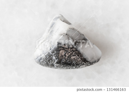 sample of polished skutterudite mineral on white 131466163
