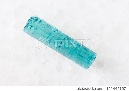 sample of raw indigolite crystal on white marble 131466167