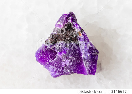 sample of rough sugilite mineral on white marble sample of rough sugilite mineral on white marble 131466171