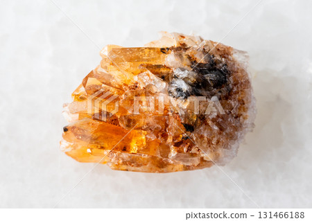 sample of rough creedite mineral on white marble 131466188