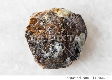 sample of rough brown titanite mineral on white sample of rough brown titanite mineral on white 131466200