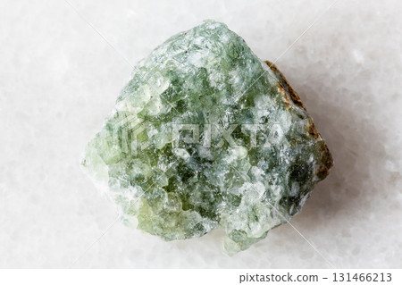 sample of uncut green aventurine rock on white 131466213