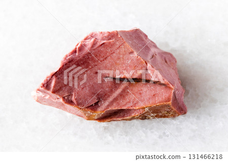 sample of raw pink mookaite mineral on white sample of raw pink mookaite mineral on white 131466218