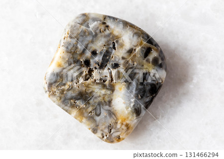 sample of tumbled oncolite mineral on white marble sample of tumbled oncolite mineral on white marble 131466294
