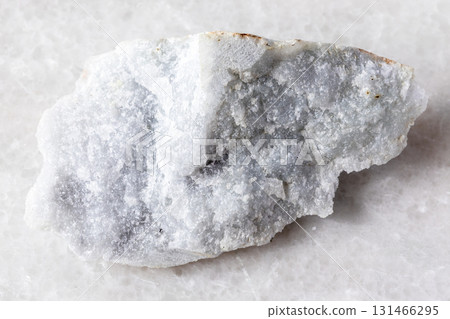 sample of raw jadeite rock on white marble 131466295