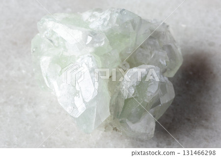 sample of raw datolite mineral on white marble sample of raw datolite mineral on white marble 131466298