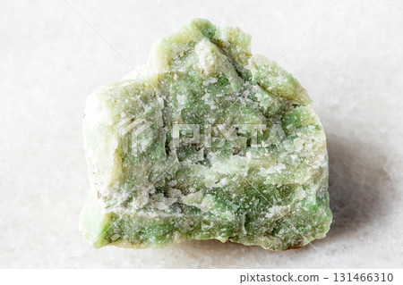 sample of raw rodingite mineral on white marble 131466310