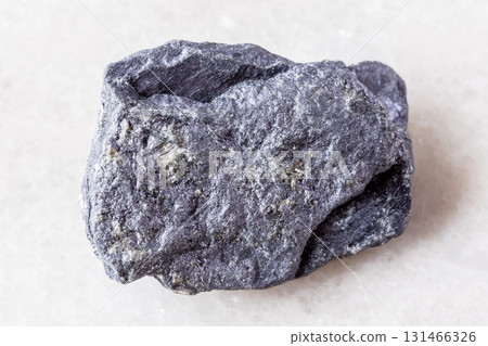 sample of raw molybdenite mineral on white marble sample of raw molybdenite mineral on white marble 131466326