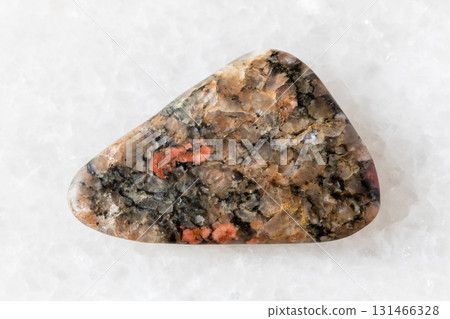 sample of polished gneissoid granite rock on white 131466328