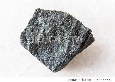 sample of peridotitic komatiite mineral on white sample of peridotitic komatiite mineral on white 131466330