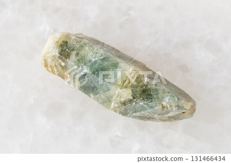 rough green sapphire corundum crystal on white rough green sapphire corundum crystal on white 131466434