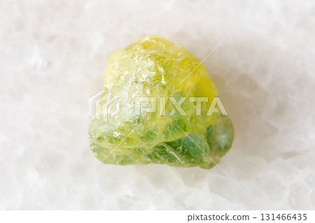 rough yellow green sapphire mineral on white rough yellow green sapphire mineral on white 131466435
