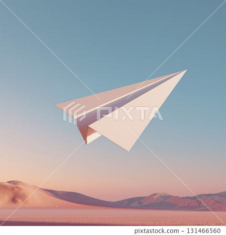 Paper airplane glides gracefully over a pastel sky and rolling sand dunes at sunset 131466560